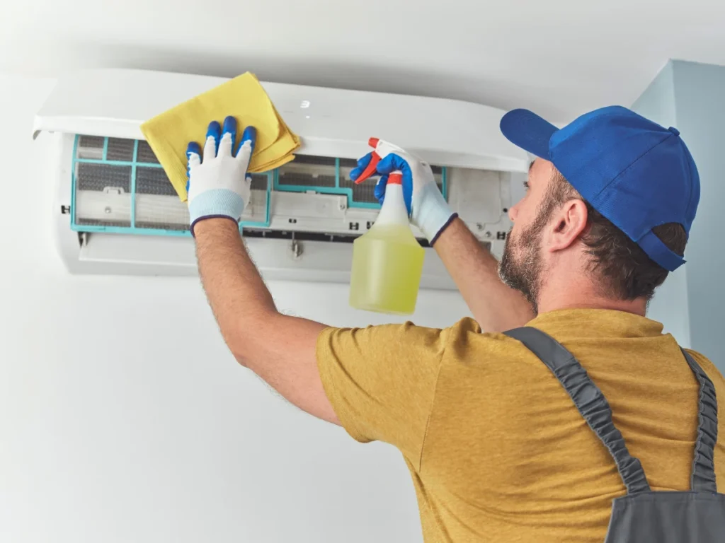 A professional replaces an outdated AC unit with a newer model as part of an AC upgrade.